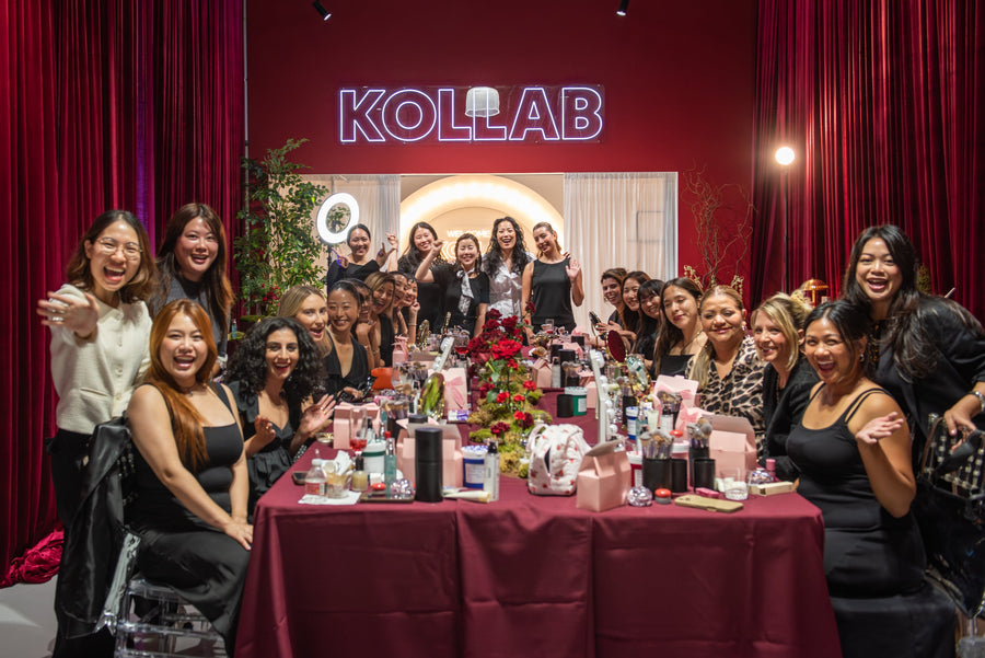 Guests and the KOLLAB team at a K-beauty masterclass under the KOLLAB neon sign
